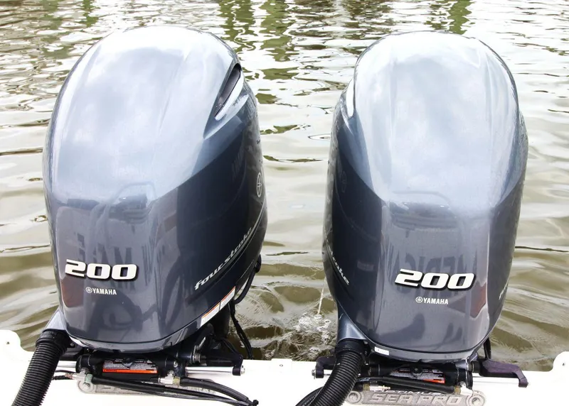 Slide: The Image of Twin Yamaha 200 outboard engines on a 2023 Sea Pro 259 DLX boat. - 20