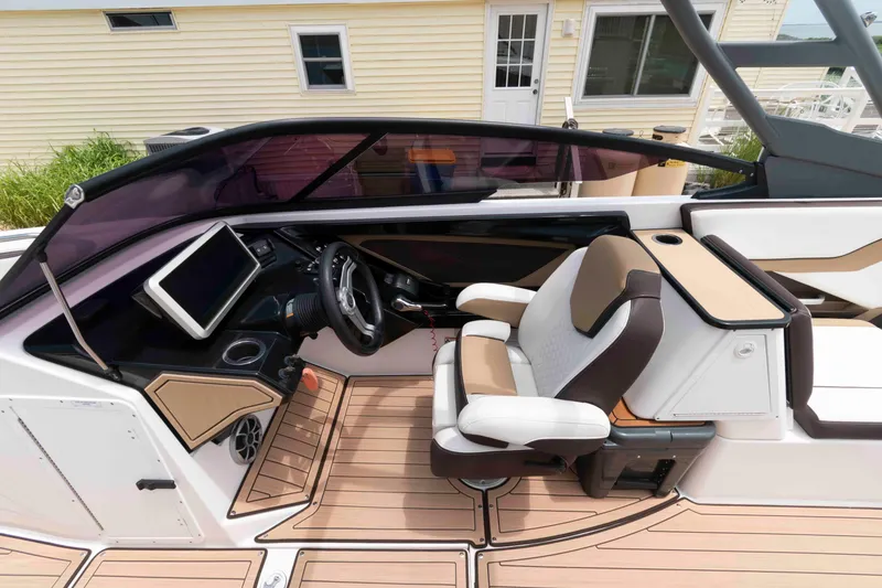 Slide: The Image of 2021 Yamaha Boats 252S cockpit with modern dashboard and comfortable seating. - 7
