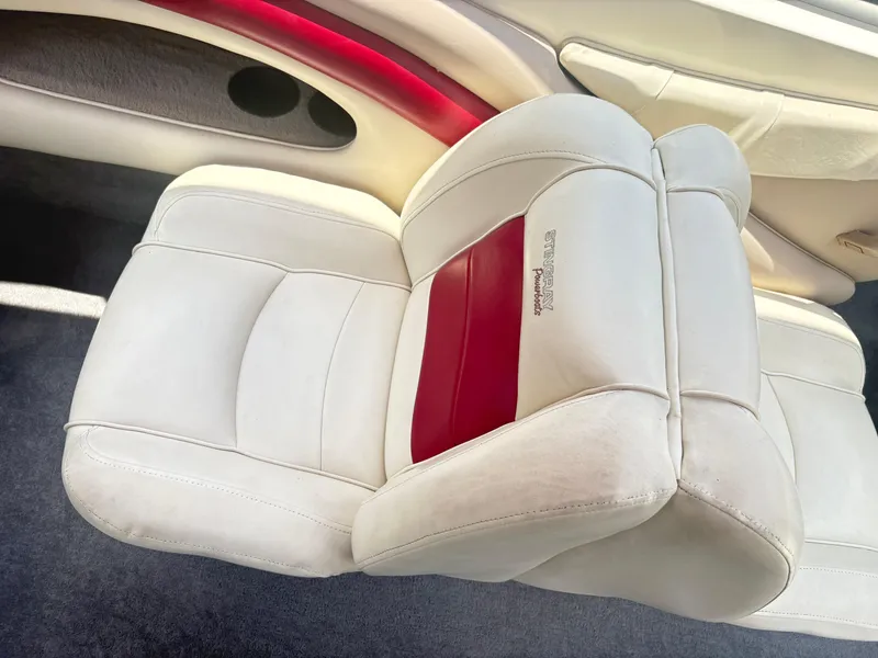 Slide: The Image of 1999 Stingray 190 LS boat interior with white and red leather seating. - 19