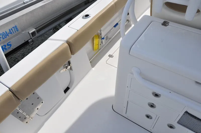 Slide: The Image of 2017 Sportsman Open 282 Center Console interior with seating and storage compartments. - 11