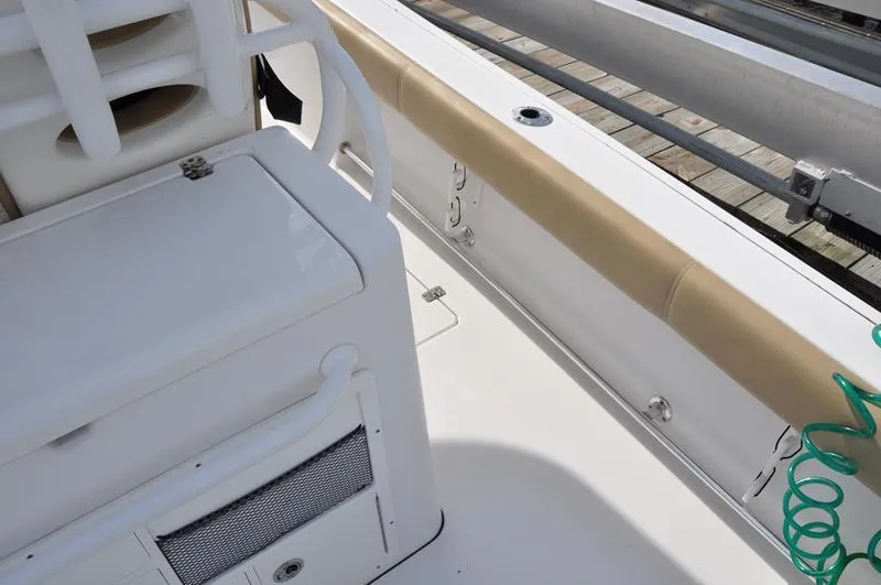 Slide: The Image of 2017 Sportsman Open 282 Center Console boat interior with seating and storage. - 12