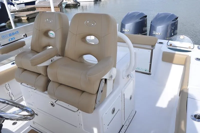 Slide: The Image of 2017 Sportsman Open 282 Center Console with dual Yamaha 300 engines and tan seating. - 15