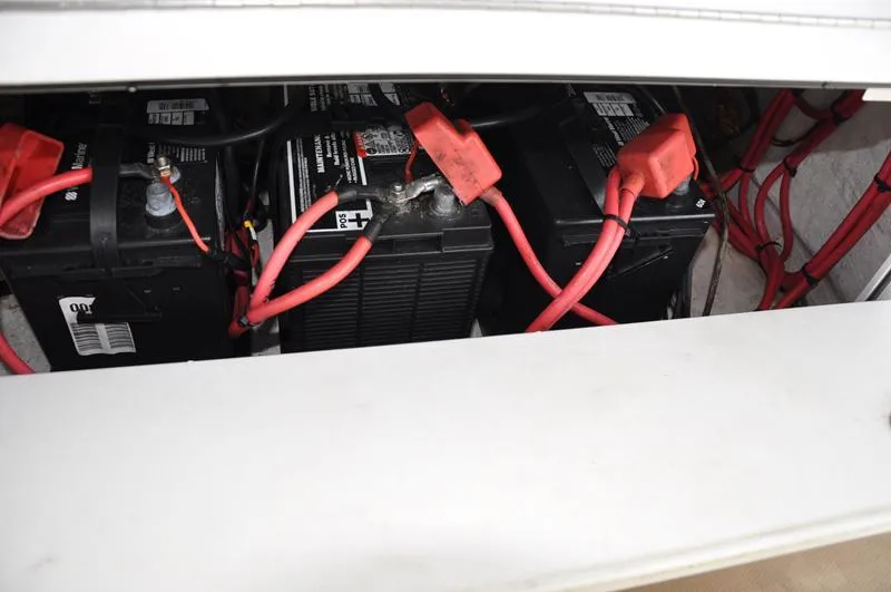 Slide: The Image of Batteries and wiring inside a 2017 Sportsman Open 282 Center Console boat. - 17