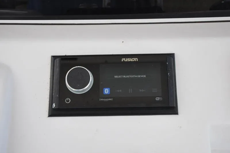 Slide: The Image of Fusion stereo system on 2017 Sportsman Open 282 Center Console boat dashboard. - 20
