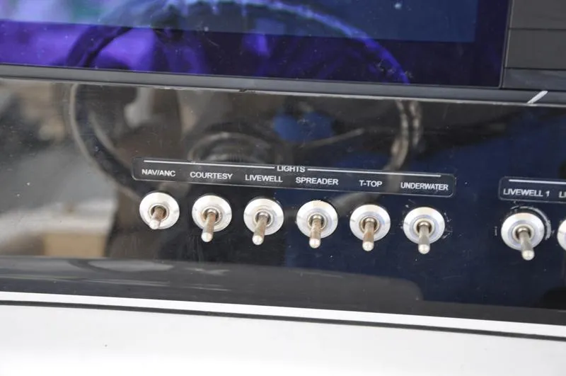 Slide: The Image of Control panel of a 2017 Sportsman Open 282 Center Console boat. - 22