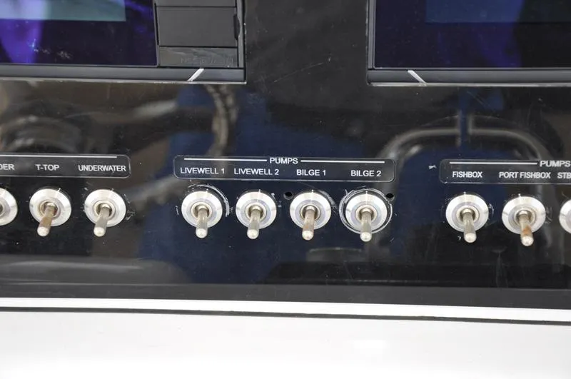 Slide: The Image of Control panel of a 2017 Sportsman Open 282 Center Console boat. - 23