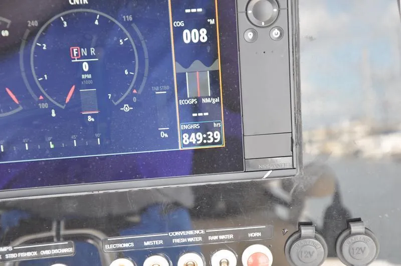 Slide: The Image of Close-up of a 2017 Sportsman Open 282 Center Console dashboard display. - 27