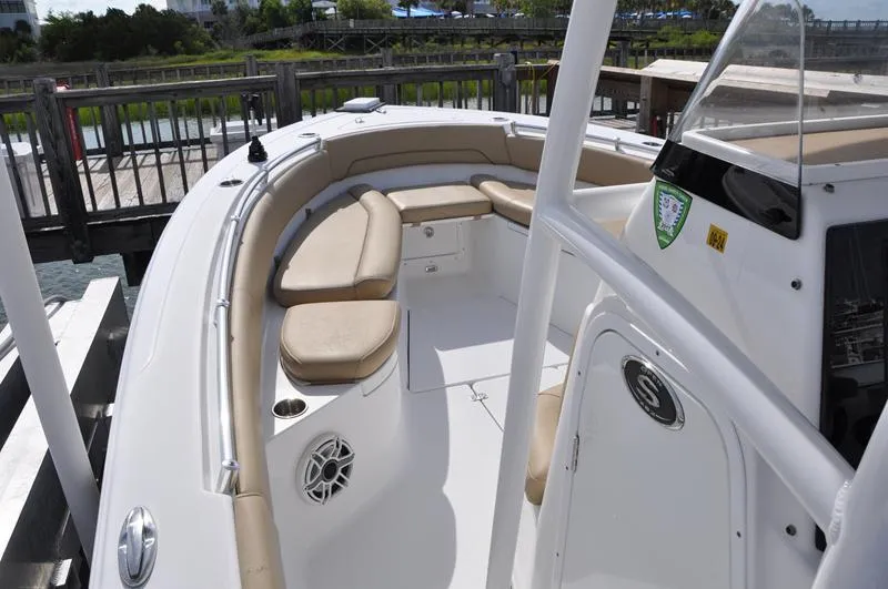 Slide: The Image of 2017 Sportsman Open 282 Center Console boat with beige seating and sleek design. - 29