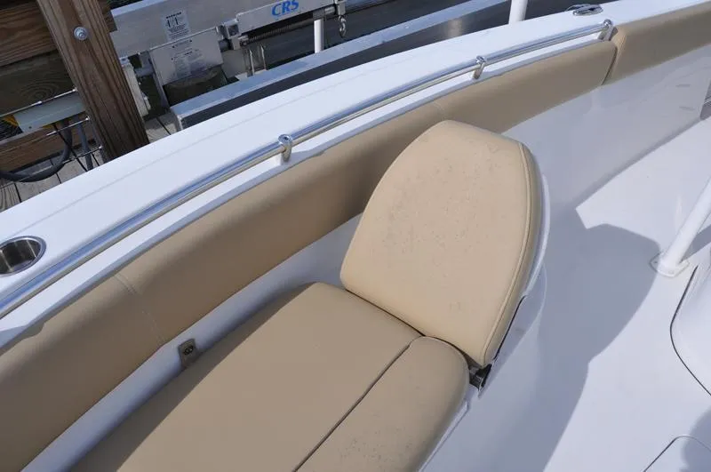 Slide: The Image of 2017 Sportsman Open 282 Center Console boat with beige seating and stainless steel railing. - 33
