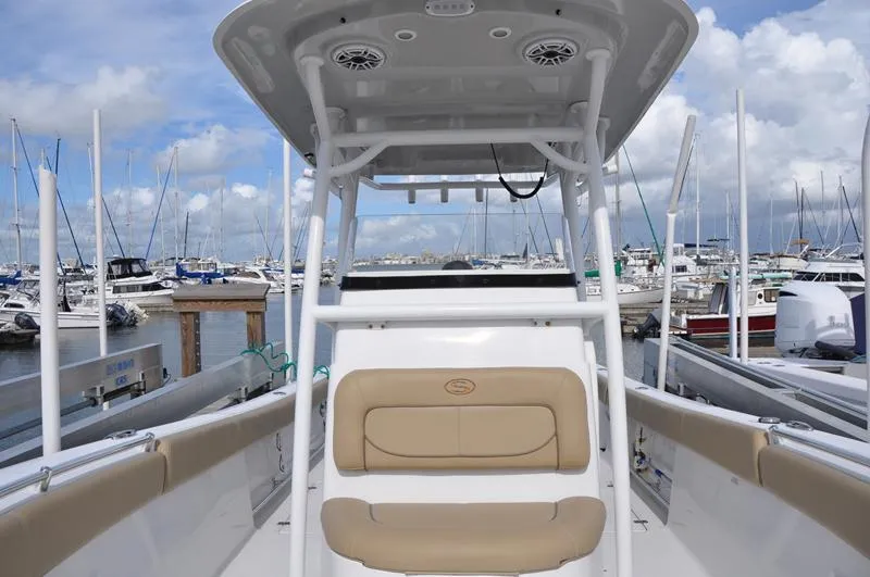 Slide: The Image of 2017 Sportsman Open 282 Center Console boat docked at marina, clear sky background. - 36