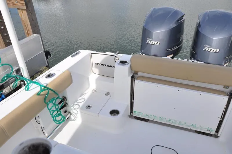 Slide: The Image of 2017 Sportsman Open 282 Center Console boat with twin 300 engines, docked. - 4