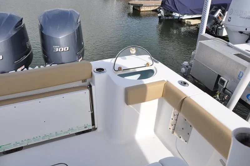 Slide: The Image of 2017 Sportsman Open 282 Center Console boat with twin Yamaha 300 engines docked. - 5