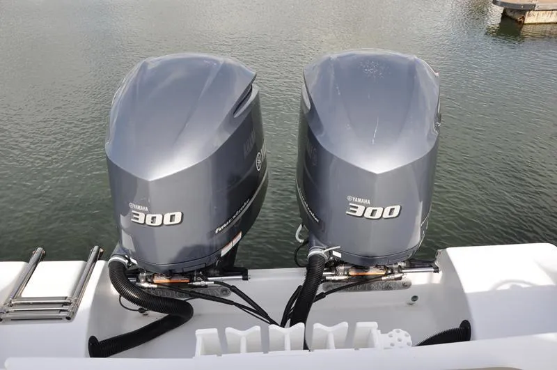 Slide: The Image of Twin Yamaha 300 engines on a 2017 Sportsman Open 282 Center Console boat. - 6