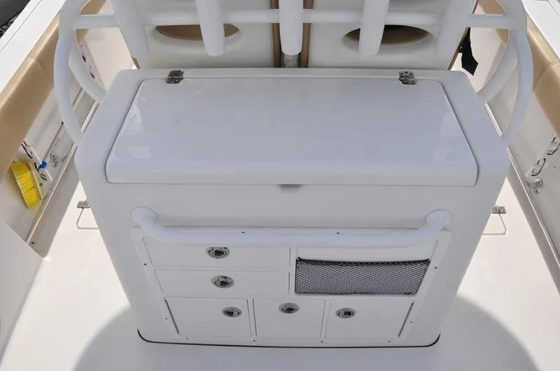 Slide: The Image of 2017 Sportsman Open 282 Center Console boat storage and seating area. - 9