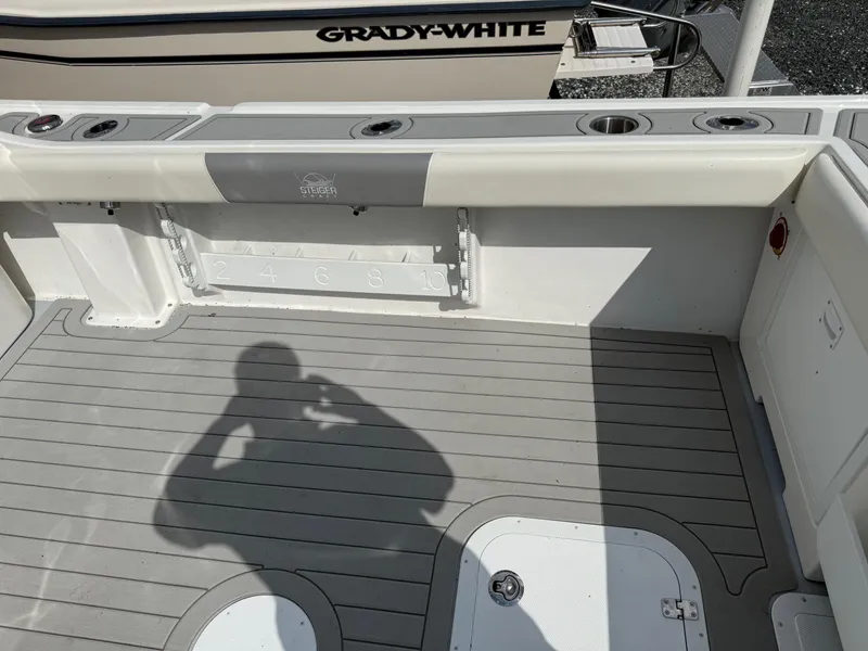 Slide: The Image of 2024 Steiger Craft 23 Miami boat deck with rod holders and measurement guide. - 11