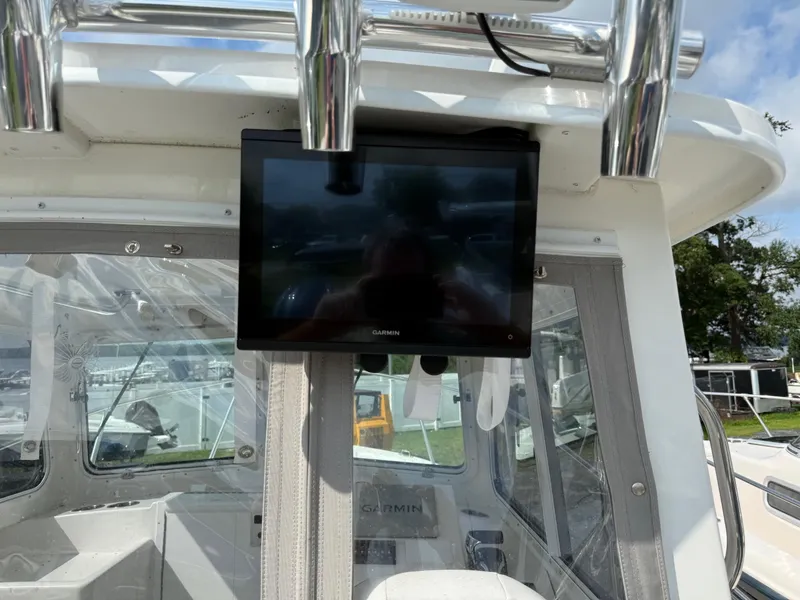 Slide: The Image of 2024 Steiger Craft 23 Miami boat interior with Garmin display screen. - 14