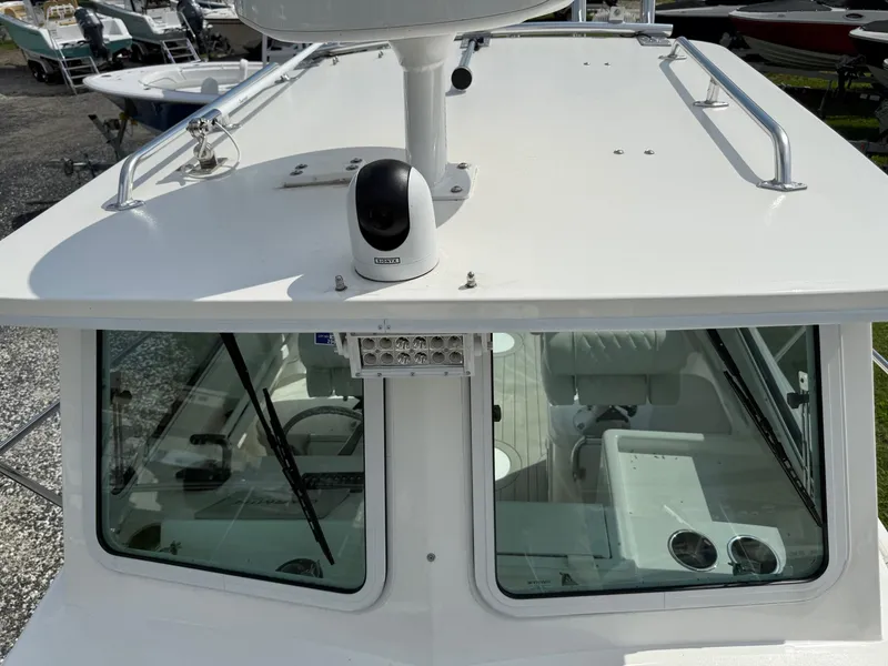 Slide: The Image of 2024 Steiger Craft 23 Miami boat cabin with radar and windshield wipers. - 23