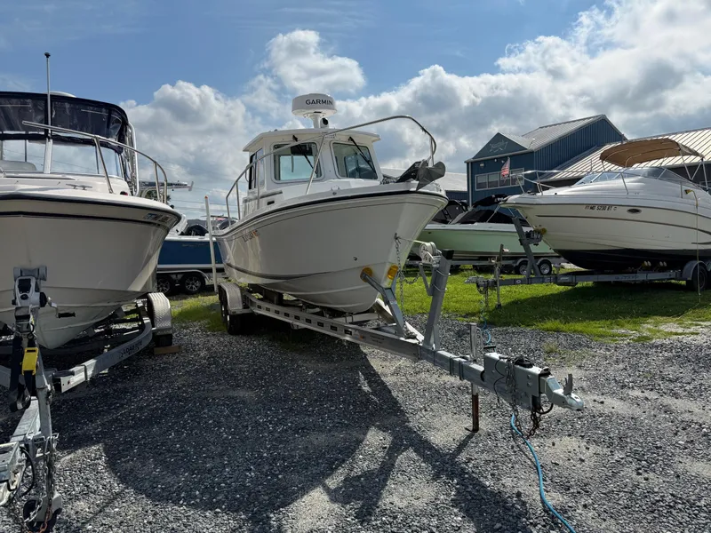 Slide: The Image of 2024 Steiger Craft 23 Miami boat on trailer, displayed outdoors. - 3