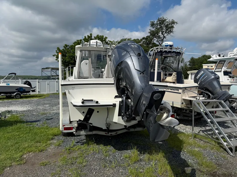 Slide: The Image of 2024 Steiger Craft 23 Miami boat with Yamaha outboard motor, parked outdoors. - 4
