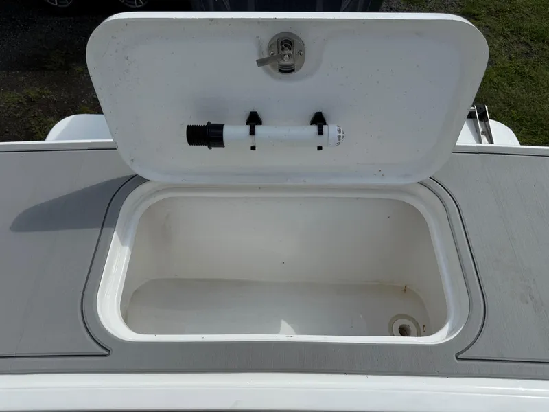Slide: The Image of Open storage compartment on 2024 Steiger Craft 23 Miami boat. - 9