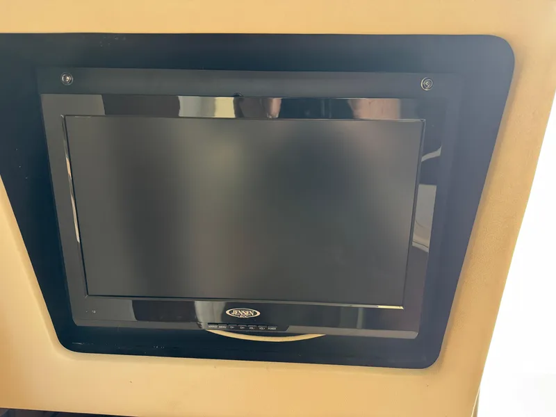 Slide: The Image of Built-in Jensen TV on 2014 Sea Ray 280 Sundancer boat. - 24