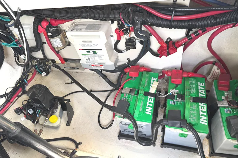 Slide: The Image of Electrical system of a 2014 Sea Ray 280 Sundancer with batteries and wiring. - 27