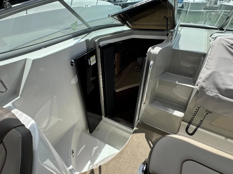 Slide: The Image of 2014 Sea Ray 280 Sundancer cabin entrance with open door and steps. - 6