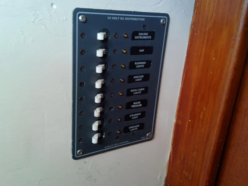 Slide: The Image of Cozy cabin interior of 1980 Whitby Yachts 42 with striped bedding and wooden finish. - 39