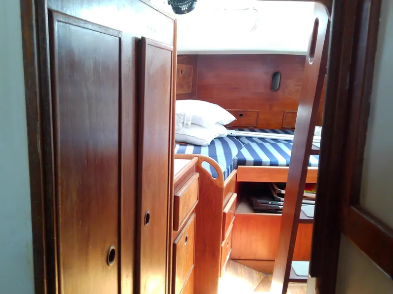 Slide: The Image of 1980 Whitby Yachts 42 bathroom with sink, mirror, and storage cabinets. - 41