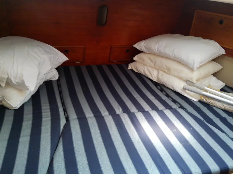 Slide: The Image of 1980 Whitby Yachts 42 bathroom with toilet, wooden accents, and countertop essentials. - 42