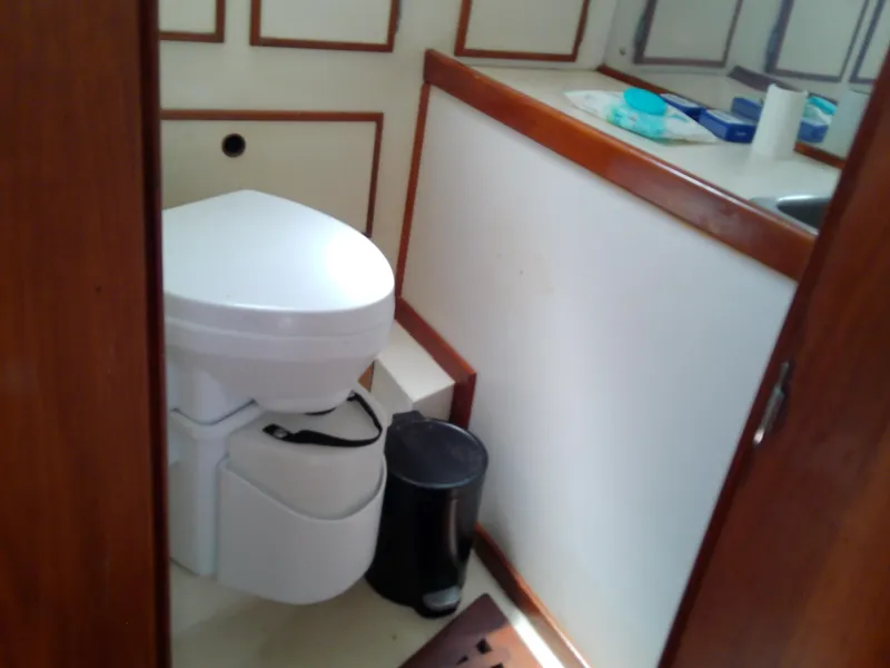 Slide: The Image of 12V DC distribution panel on 1980 Whitby Yachts 42, featuring various light and instrument controls. - 49