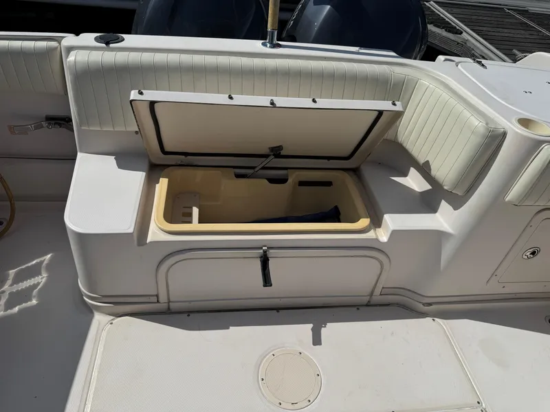 Slide: The Image of 2003 Grady-White Marlin 300 boat interior with open storage compartment. - 14