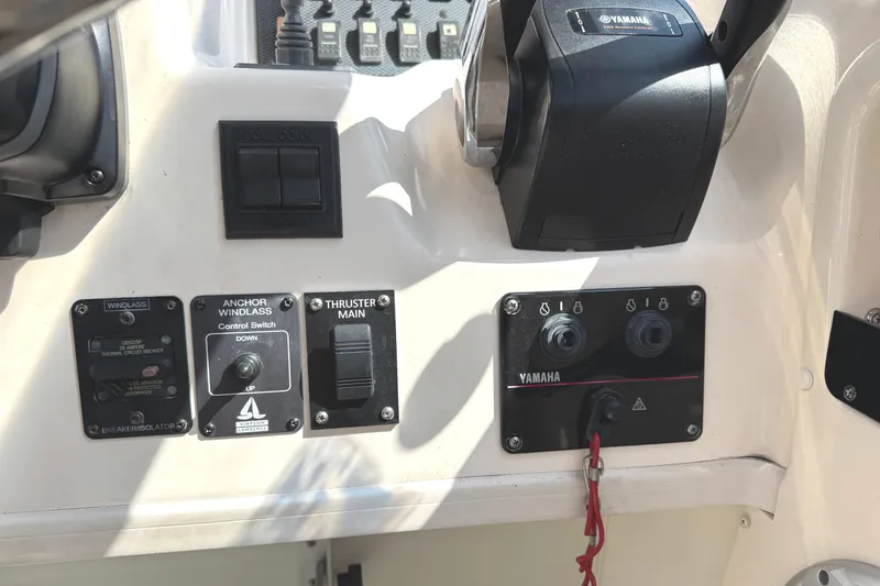 Slide: The Image of Control panel of a 2003 Grady-White Marlin 300 boat with Yamaha throttle. - 22