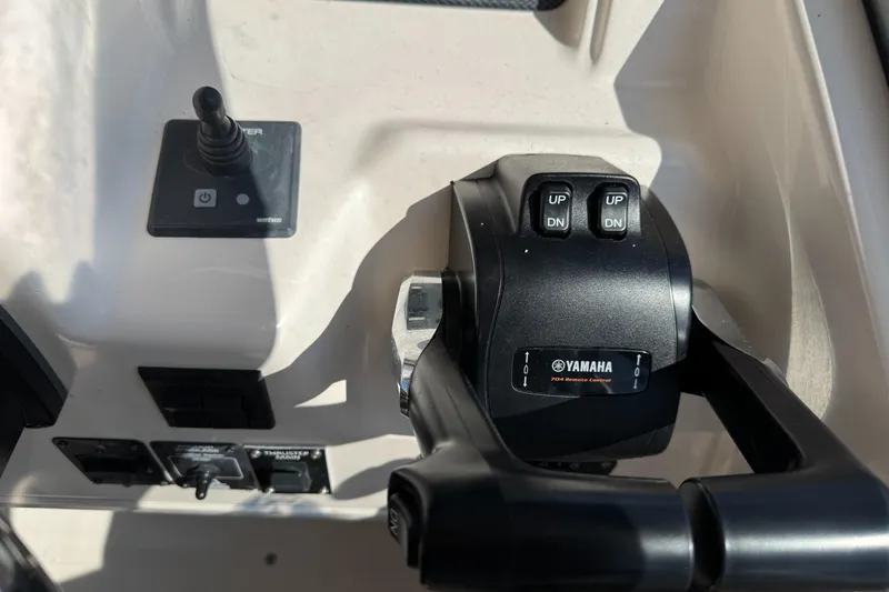 Slide: The Image of Control panel of a 2003 Grady-White Marlin 300 boat with Yamaha throttle. - 23