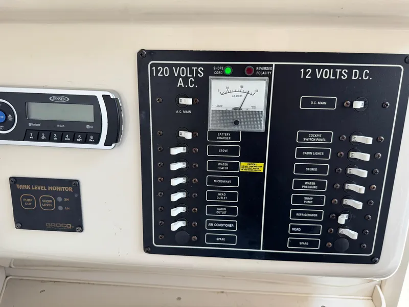Slide: The Image of Electrical control panel on a 2003 Grady-White Marlin 300 boat. - 25