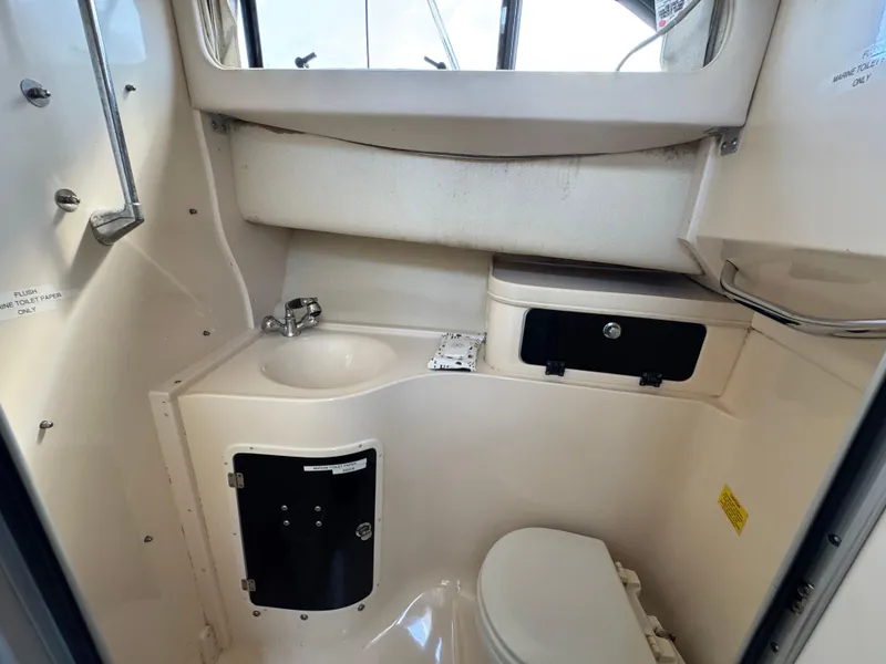Slide: The Image of 2003 Grady-White Marlin 300 boat bathroom with sink and toilet. - 26