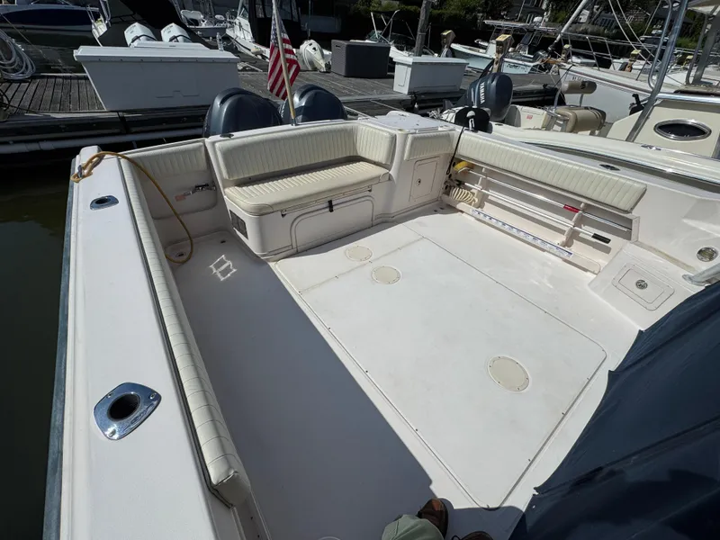 Slide: The Image of 2003 Grady-White Marlin 300 boat interior with spacious seating and fishing equipment. - 3