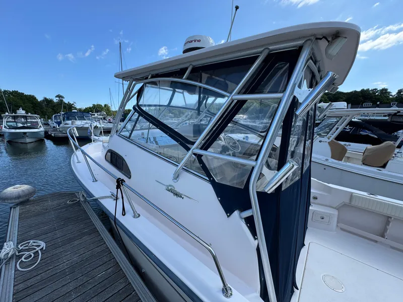 Slide: The Image of 2003 Grady-White Marlin 300 boat docked at marina under clear blue sky. - 35