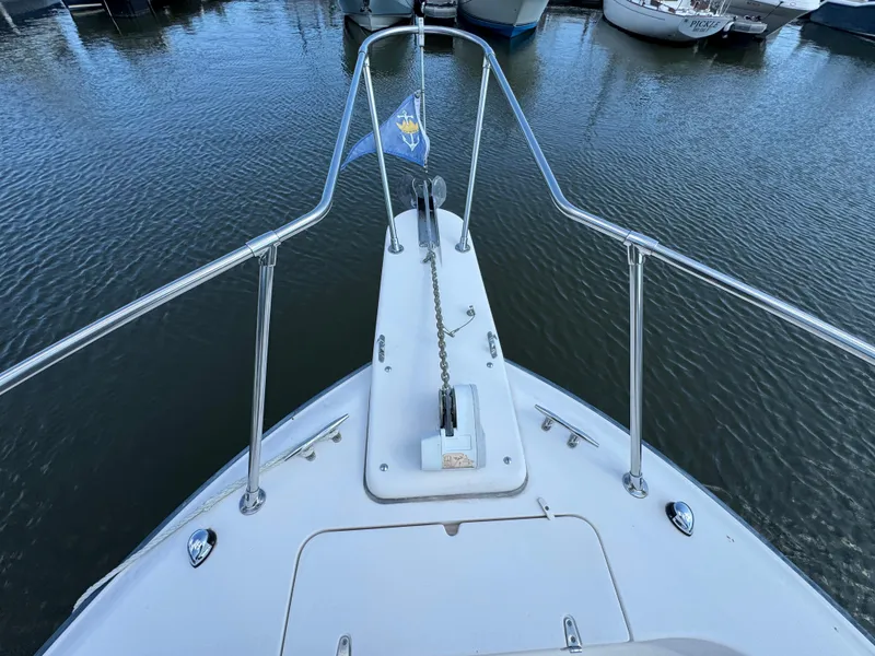 Slide: The Image of Bow view of 2003 Grady-White Marlin 300 boat at marina. - 38