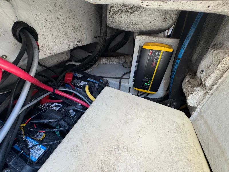 Slide: The Image of Electrical system of a 2003 Grady-White Marlin 300 boat, featuring wiring and a battery charger. - 39