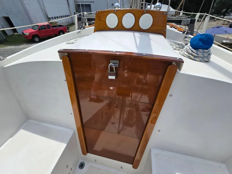 Slide: The Image of 1984 Bristol 31.1 sailboat cockpit with polished wood hatch and nautical equipment. - 14