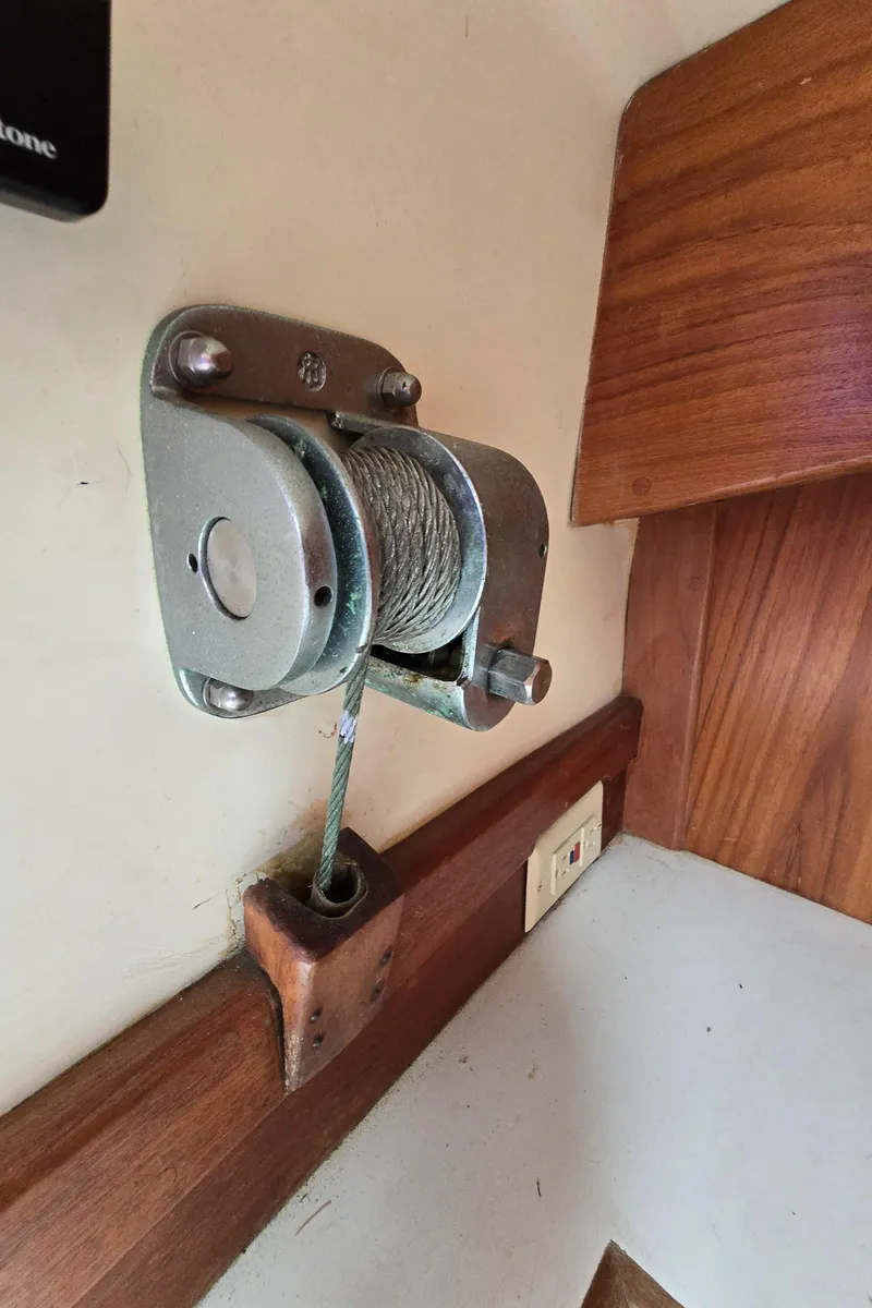 Slide: The Image of Wall-mounted winch with cable on a Bristol 31.1, 1984 model, wooden interior. - 15