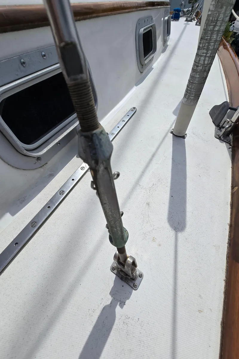 Slide: The Image of Close-up of 1984 Bristol 31.1 sailboat deck with rigging and portholes. - 32