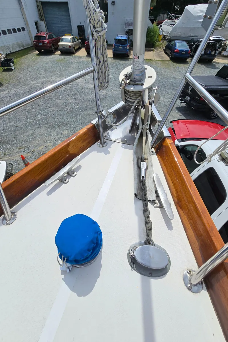 Slide: The Image of Deck of 1984 Bristol 31.1 sailboat with anchor chain and blue cover. - 34
