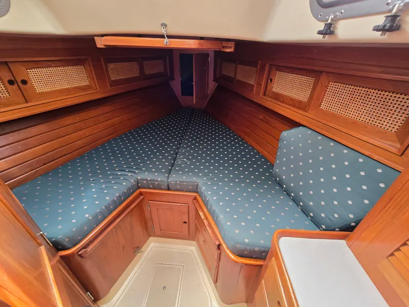 Slide: The Image of 1984 Bristol 31.1 yacht interior with wooden finish and polka dot cushions. - 8