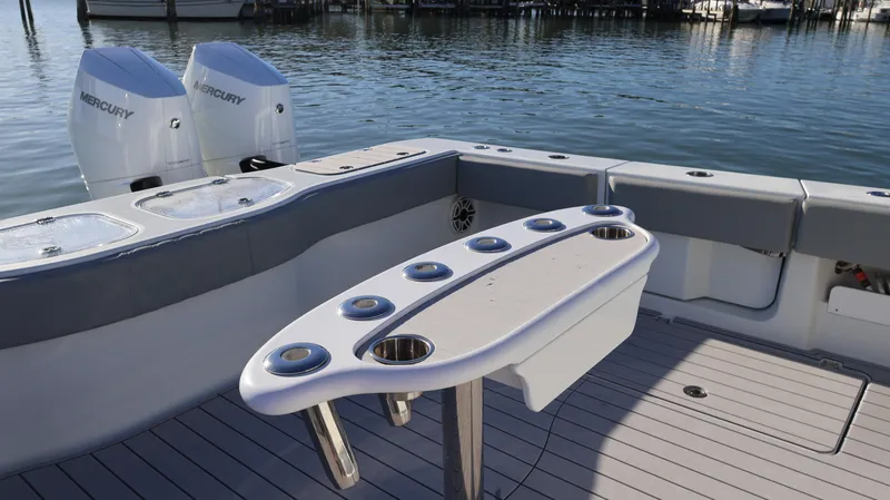 Slide: The Image of Freeman 47 boat deck with rod holders and Mercury engines, 2021 model. - 15