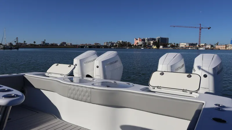 Slide: The Image of Freeman 47 boat, 2021 model, with powerful engines, docked near a city skyline. - 25