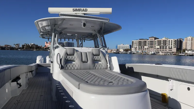 Slide: The Image of Luxury Freeman 47 boat, 2021 model, with sleek design and spacious deck, docked by waterfront. - 30