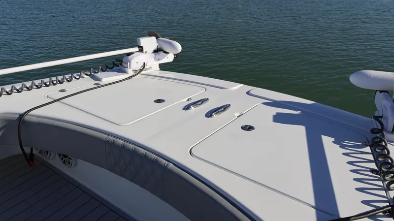Slide: The Image of 2021 Freeman 47 boat deck with fishing equipment, on calm water. - 34