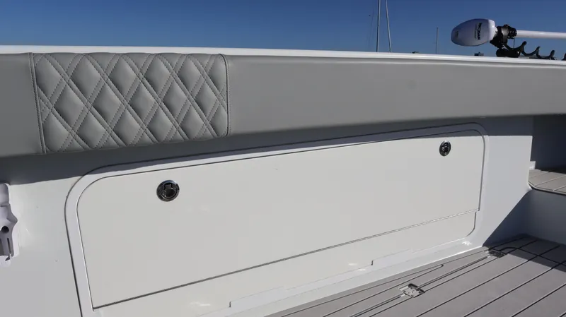 Slide: The Image of Freeman 47 boat interior, 2021 model, featuring quilted upholstery and storage compartment. - 37